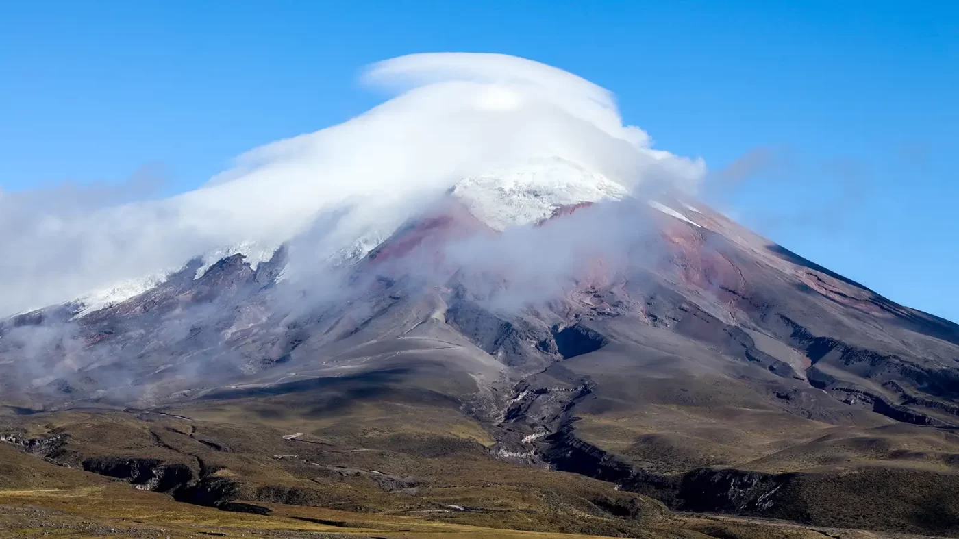 Clouds dance over the summit of Cotopaxi Volcano
