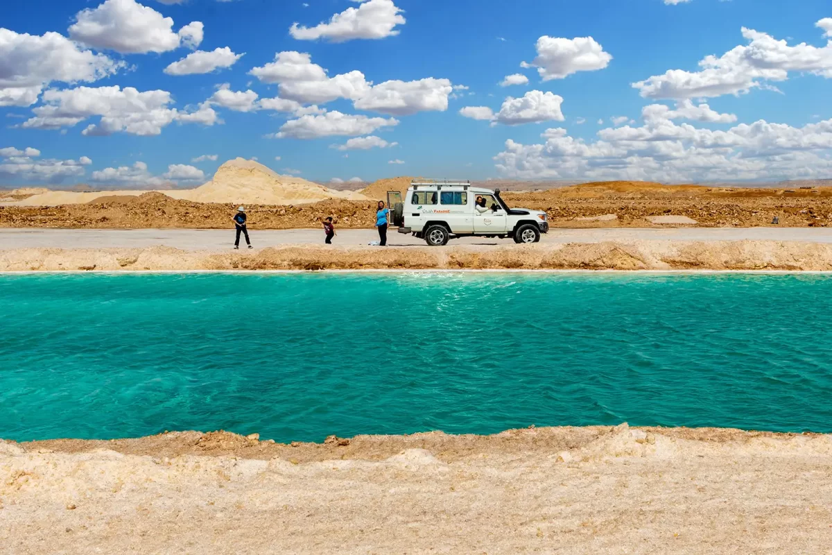 A family explores the salt pools in Siwa Egypt